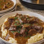 Slow Cooker Beef and Gravy Over Mashed Potatoes